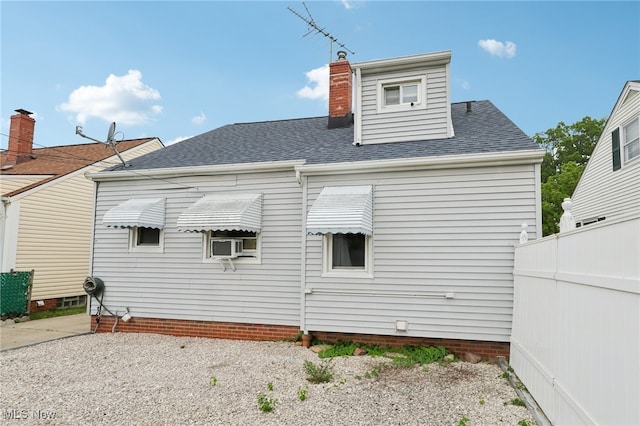 20800 Wilmore Ave, Euclid, OH 44123 - rear view of house with a chimney and roof with shingles