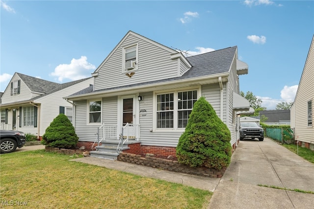 20800 Wilmore Ave, Euclid, OH 44123 - view of front of property with a front lawn, entry steps, a shingled roof, and cooling unit