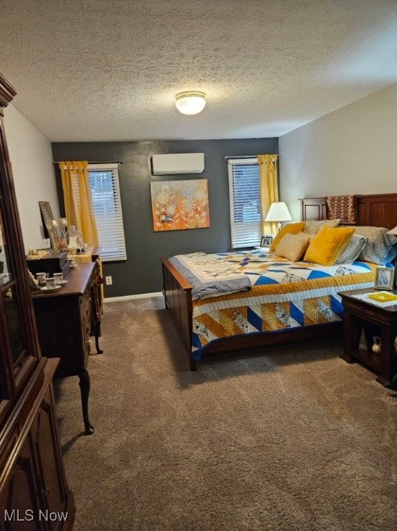 110 Olson Spur, Munroe Falls, OH 44262 - carpeted bedroom with multiple windows, a wall mounted air conditioner, and a textured ceiling