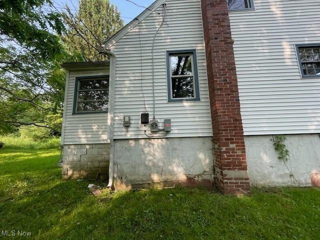 15262 Wadsworth Rittman Rd, Rittman, OH 44270 - view of home's exterior featuring a yard