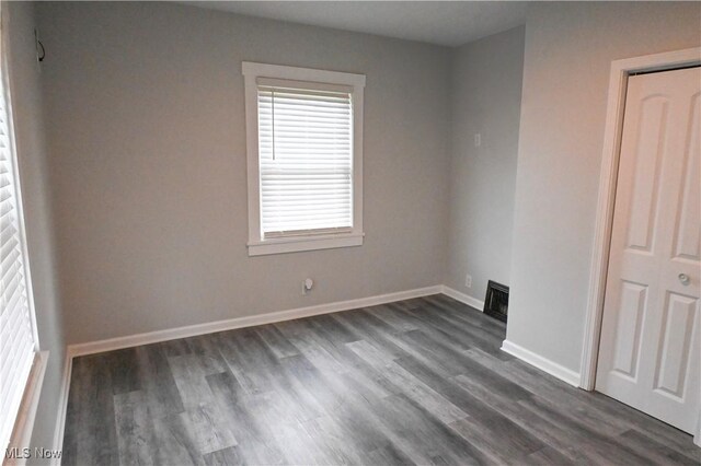2948 Maple Ave NE, Canton, OH 44714 - unfurnished room featuring dark wood-style floors and baseboards