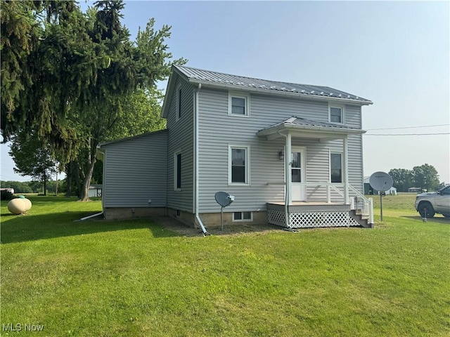 8973 Matty Rd, West Salem, OH 44287 - rear view of property featuring a lawn and metal roof