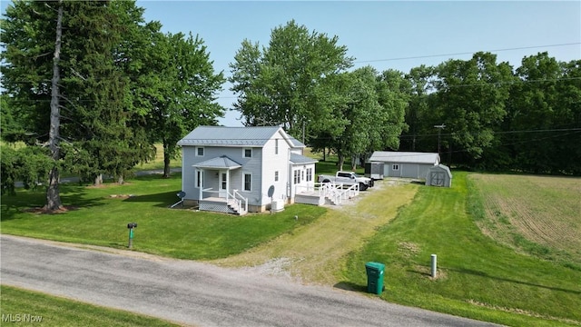 8973 Matty Rd, West Salem, OH 44287 - view of front of home with dirt driveway, a front lawn, and metal roof
