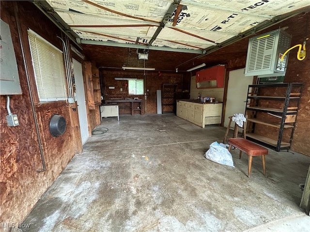 8973 Matty Rd, West Salem, OH 44287 - garage with a garage door opener, a heating unit, and electric panel