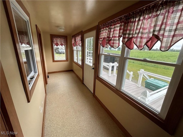 8973 Matty Rd, West Salem, OH 44287 - unfurnished sunroom featuring baseboards