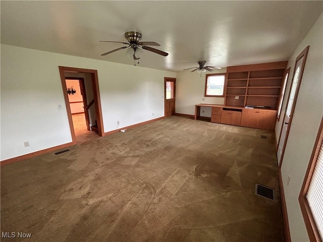 8973 Matty Rd, West Salem, OH 44287 - unfurnished living room featuring carpet flooring, baseboards, and ceiling fan