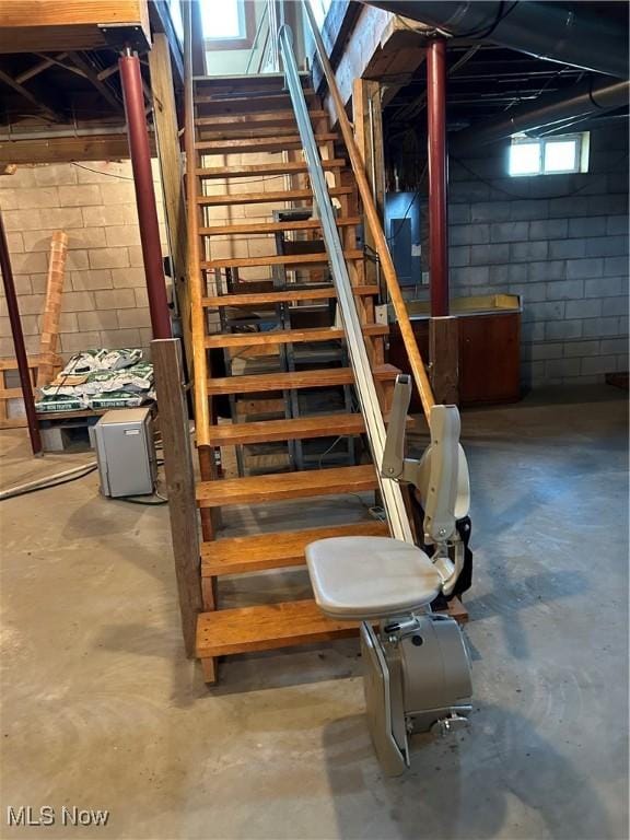 8973 Matty Rd, West Salem, OH 44287 - stairway featuring concrete floors, electric panel, and concrete block wall
