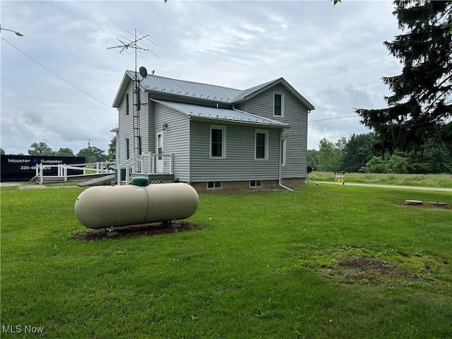 8973 Matty Rd, West Salem, OH 44287 - view of side of home with metal roof and a lawn