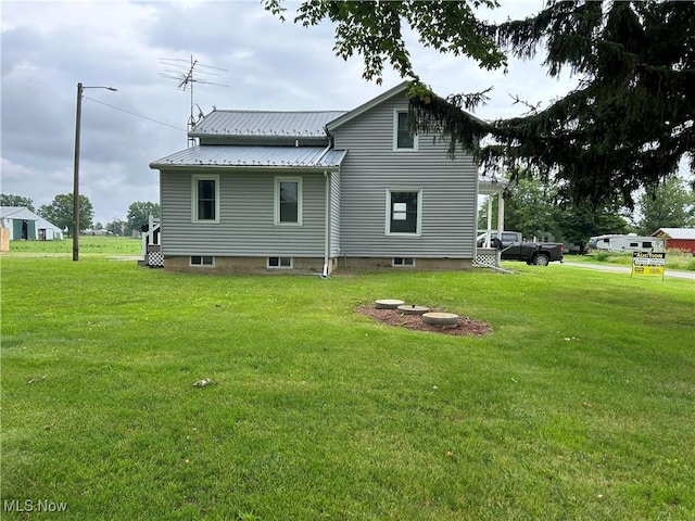 8973 Matty Rd, West Salem, OH 44287 - back of property with a yard and metal roof