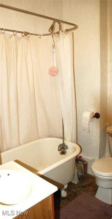 4354 E 71st St, Cleveland, OH 44105 - bathroom featuring vanity, a freestanding bath, and toilet