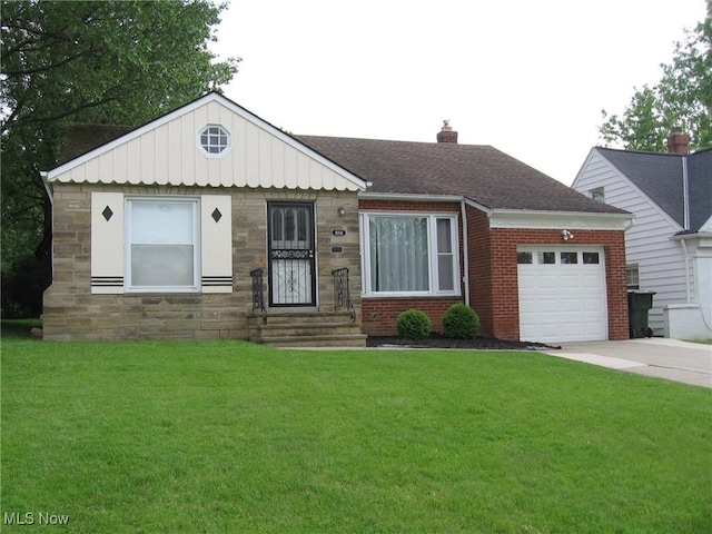 4106 Colony Rd, South Euclid, OH 44121 - view of front facade featuring an attached garage, driveway, a front yard, a chimney, and stone siding