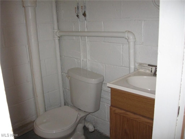 4106 Colony Rd, South Euclid, OH 44121 - bathroom with concrete block wall and vanity