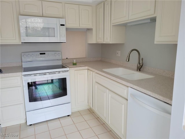1110 By The Shores Dr, Huron, OH 44839 - kitchen with white appliances, a sink, light countertops, and light tile patterned floors