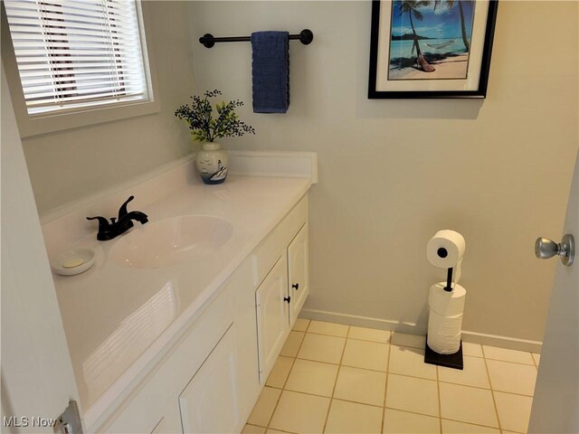 1110 By The Shores Dr, Huron, OH 44839 - bathroom featuring vanity, tile patterned floors, and baseboards