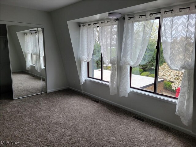 1110 By The Shores Dr, Huron, OH 44839 - unfurnished dining area with carpet floors and baseboards