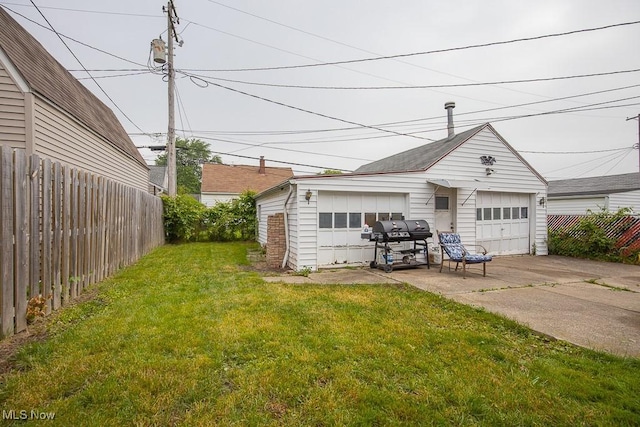 7428 Ira Ave, Brooklyn, OH 44144 - view of yard featuring a detached garage and an outbuilding