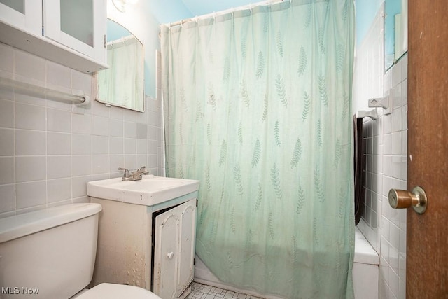 7428 Ira Ave, Brooklyn, OH 44144 - full bathroom featuring tile walls, vanity, and shower / tub combo with curtain