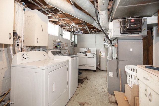 7428 Ira Ave, Brooklyn, OH 44144 - washroom with cabinet space, gas water heater, and independent washer and dryer