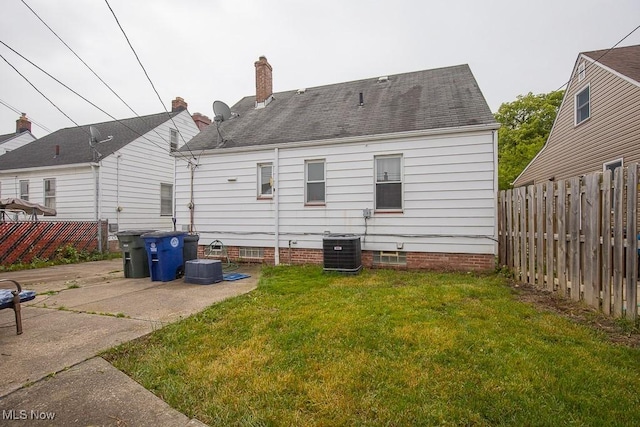 7428 Ira Ave, Brooklyn, OH 44144 - rear view of house with a fenced backyard, roof with shingles, a patio area, and a chimney