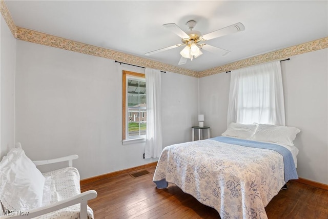 157 W 45th St, Shadyside, OH 43947 - bedroom featuring baseboards, hardwood / wood-style flooring, and ceiling fan