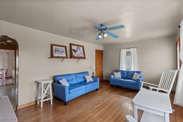 157 W 45th St, Shadyside, OH 43947 - living room with a ceiling fan, arched walkways, wood finished floors, and baseboards