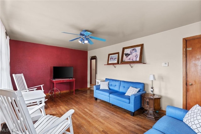 157 W 45th St, Shadyside, OH 43947 - living area with arched walkways, wood finished floors, and ceiling fan