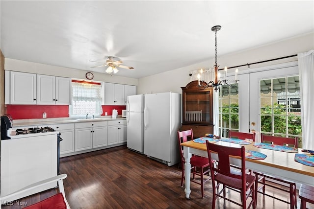 157 W 45th St, Shadyside, OH 43947 - kitchen featuring white appliances, a sink, light countertops, ceiling fan, and dark wood-style floors