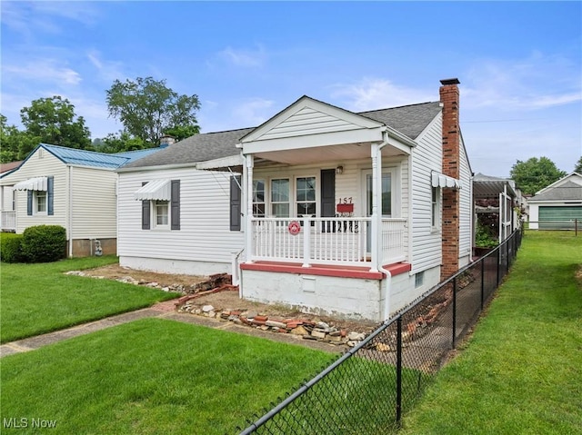 157 W 45th St, Shadyside, OH 43947 - view of front of home with covered porch, a chimney, and a shingled roof