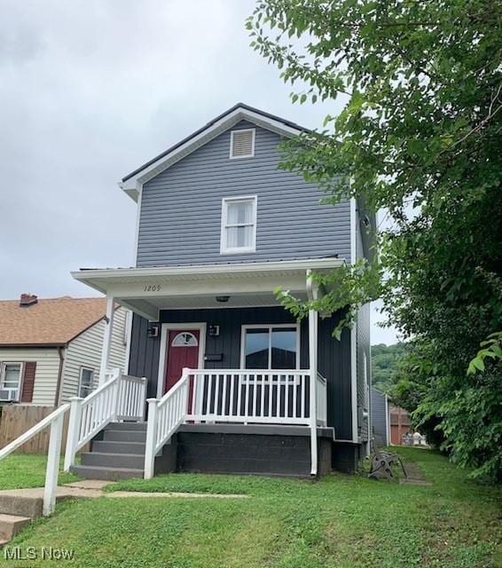 1209 N 4th St, Toronto, OH 43964 - view of front of property featuring covered porch and board and batten siding