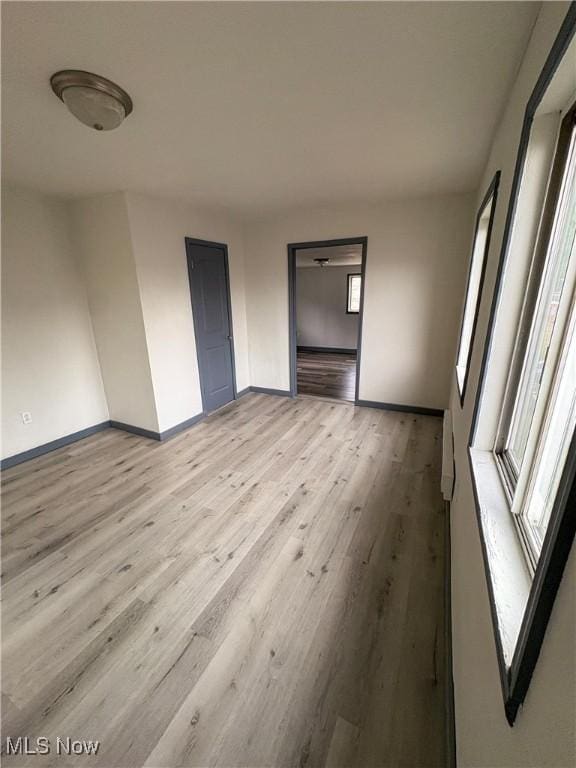 1019 Commerce St, Wellsville, OH 43968 - unfurnished bedroom featuring light wood-type flooring