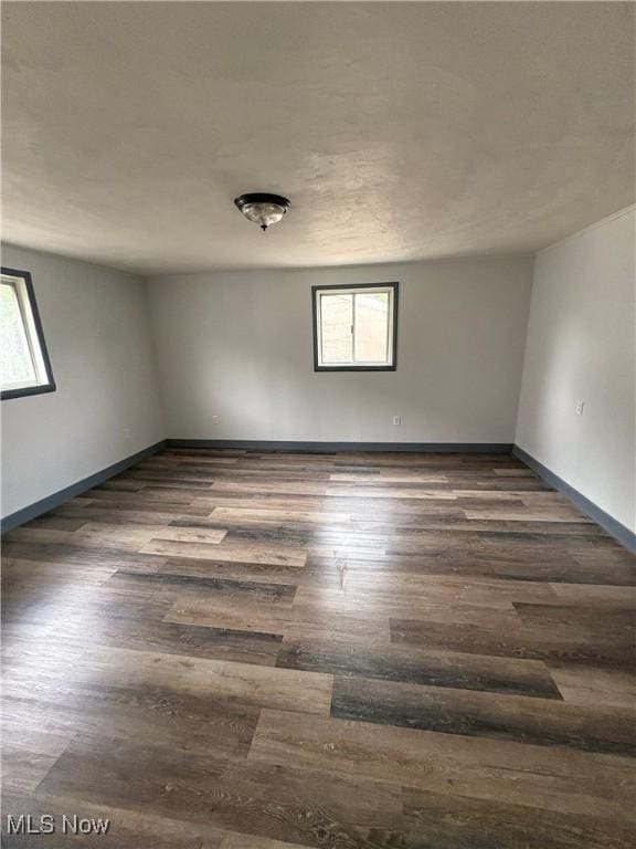 1019 Commerce St, Wellsville, OH 43968 - empty room with plenty of natural light and wood finished floors