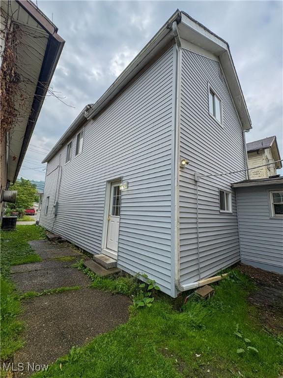 1019 Commerce St, Wellsville, OH 43968 - view of property exterior featuring entry steps