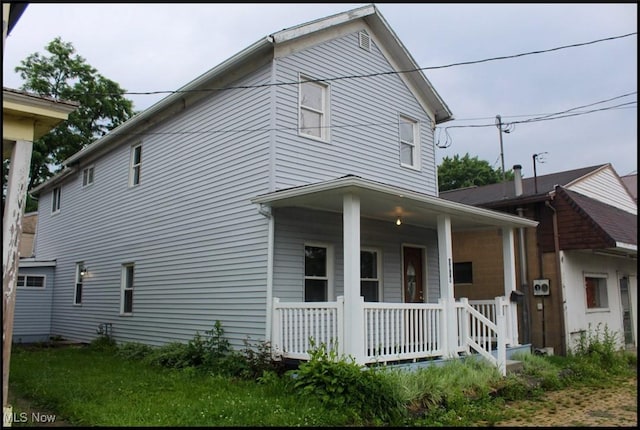 1019 Commerce St, Wellsville, OH 43968 - view of side of property featuring a porch