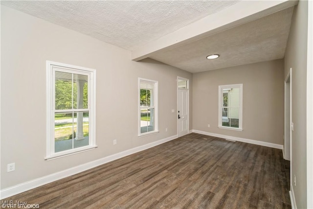 190 Columbus St, Chagrin Falls, OH 44022 - unfurnished room with dark wood-style floors, beam ceiling, baseboards, and a textured ceiling