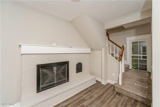 190 Columbus St, Chagrin Falls, OH 44022 - detailed view of wood finished floors, baseboards, and a glass covered fireplace