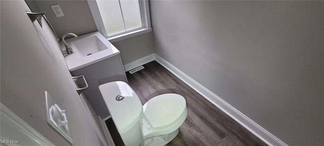190 Columbus St, Chagrin Falls, OH 44022 - bathroom with wood finished floors, vanity, toilet, and baseboards
