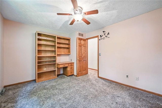 9233 Cain Dr NE, Warren, OH 44484 - unfurnished bedroom featuring light carpet, baseboards, a textured ceiling, and ceiling fan
