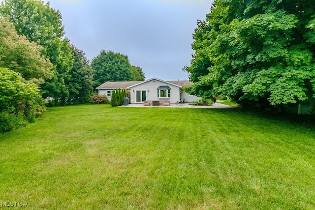 5081 Middle Ridge Rd, Perry, OH 44081 - view of grassy yard with a patio area