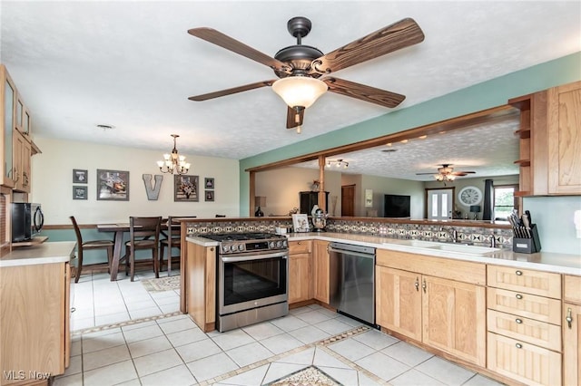 5081 Middle Ridge Rd, Perry, OH 44081 - kitchen featuring stainless steel appliances, a sink, a ceiling fan, light brown cabinets, and light tile patterned floors
