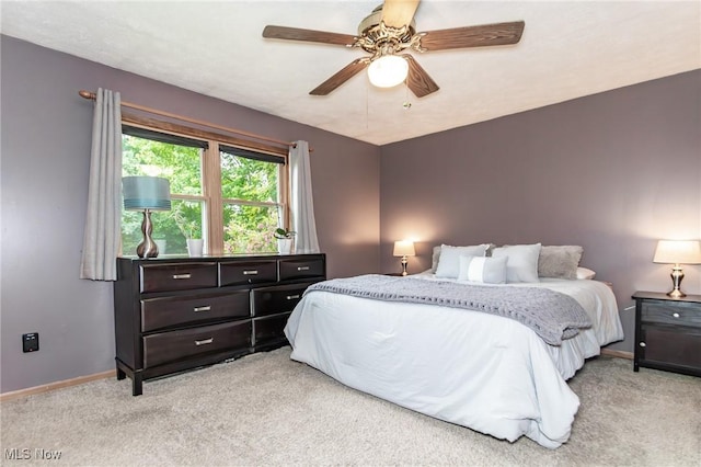 5081 Middle Ridge Rd, Perry, OH 44081 - bedroom featuring light carpet, baseboards, and a ceiling fan