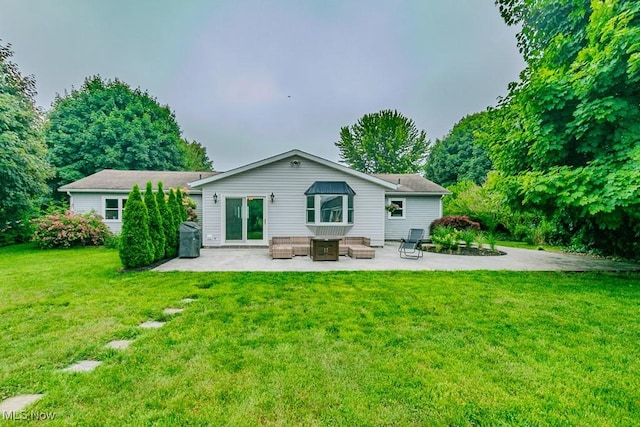 5081 Middle Ridge Rd, Perry, OH 44081 - back of property with a patio area, a lawn, and an outdoor living space
