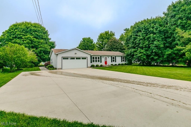 5081 Middle Ridge Rd, Perry, OH 44081 - ranch-style home with a garage, a front lawn, and driveway