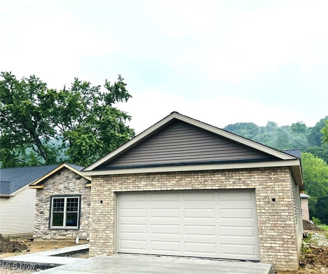 291 Haley Cir, Weirton, WV 26062 - ranch-style house with a garage, concrete driveway, and brick siding