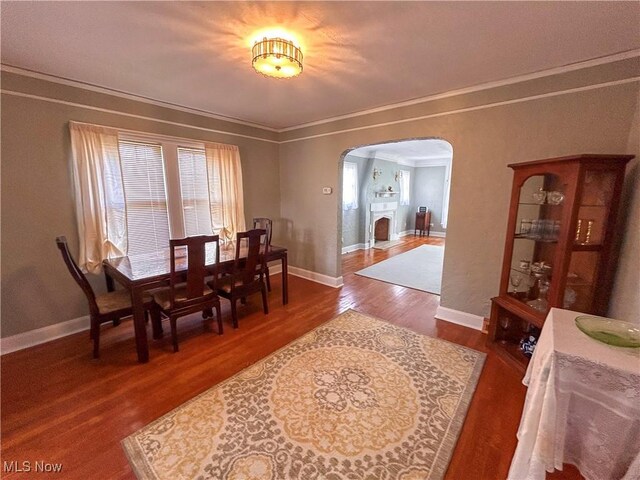 31 Marlindale Ave, Boardman, OH 44512 - dining space featuring arched walkways, wood finished floors, crown molding, and baseboards