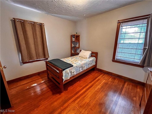 31 Marlindale Ave, Boardman, OH 44512 - bedroom featuring hardwood / wood-style floors, baseboards, and a textured ceiling