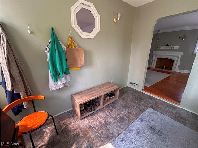 31 Marlindale Ave, Boardman, OH 44512 - mudroom featuring stone finish flooring, arched walkways, a fireplace, and baseboards