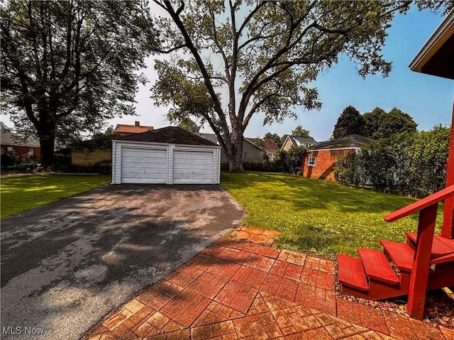 31 Marlindale Ave, Boardman, OH 44512 - view of green lawn with an outbuilding and a detached garage