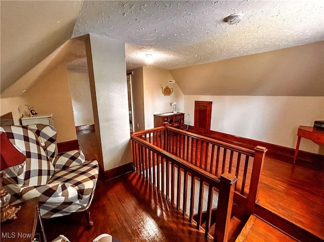 31 Marlindale Ave, Boardman, OH 44512 - additional living space featuring lofted ceiling, hardwood / wood-style floors, baseboards, and a textured ceiling