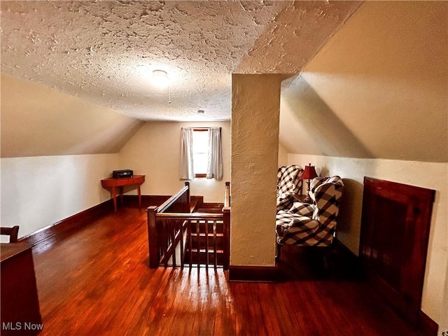 31 Marlindale Ave, Boardman, OH 44512 - bonus room featuring wood finished floors, vaulted ceiling, baseboards, and a textured ceiling