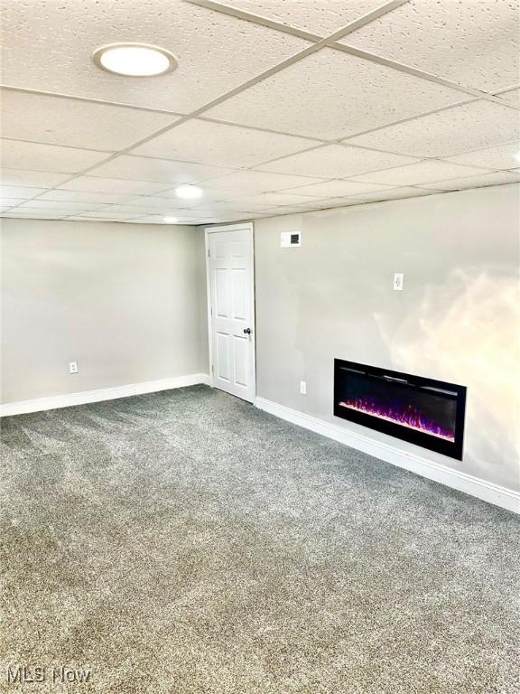 1389 Diagonal Rd, Akron, OH 44320 - finished below grade area with a glass covered fireplace, baseboards, carpet, and a paneled ceiling